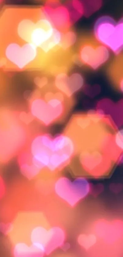 Vibrant heart bokeh wallpaper with pink and orange hues.