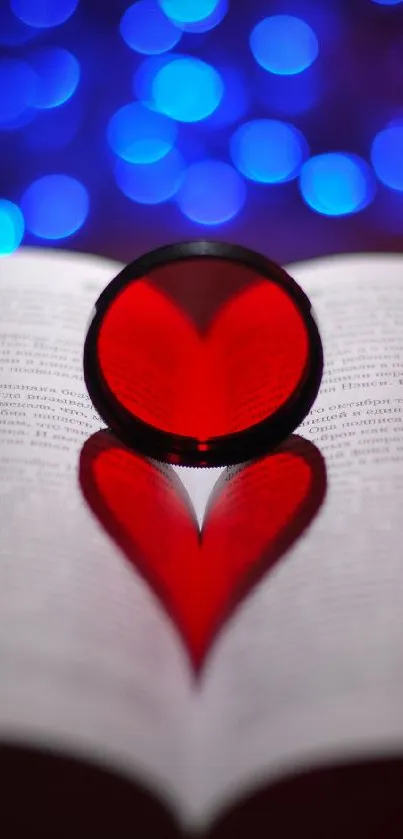 Heart shadow on book with blue bokeh lights.