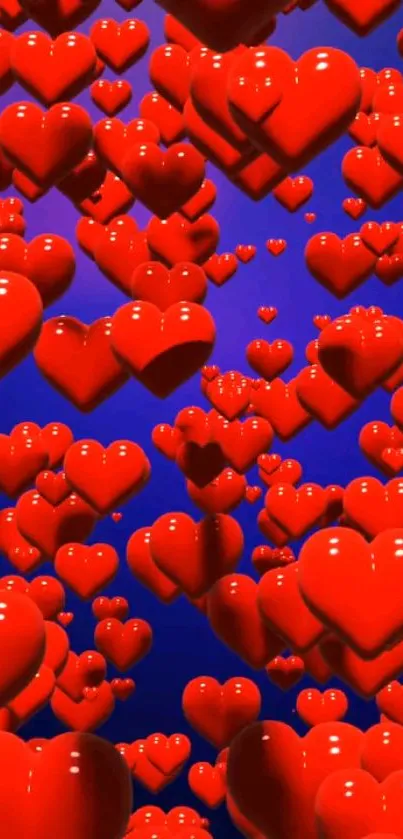 Glossy red hearts floating on blue background wallpaper.