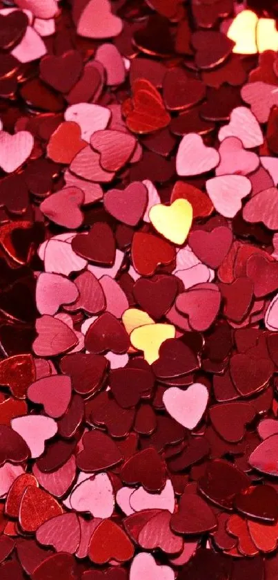 Vibrant mobile wallpaper with heart confetti in red, pink, and yellow hues.