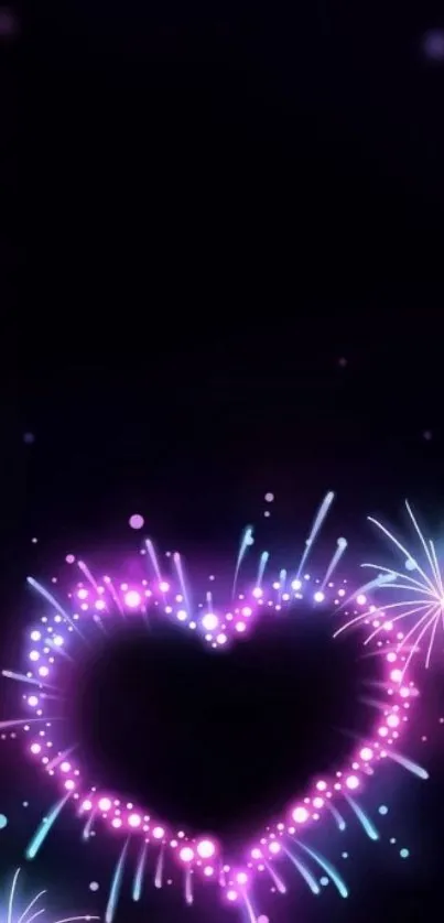 Neon heart-shaped fireworks on dark background.