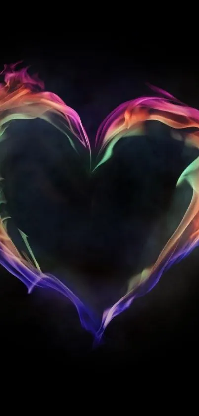 Vibrant heart-shaped flame on dark background wallpaper.