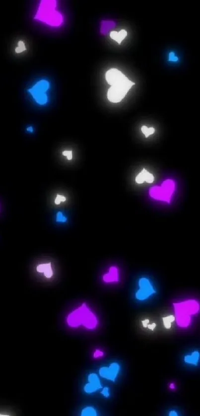 Wallpaper with glowing hearts on a black background in pink, blue, and white.