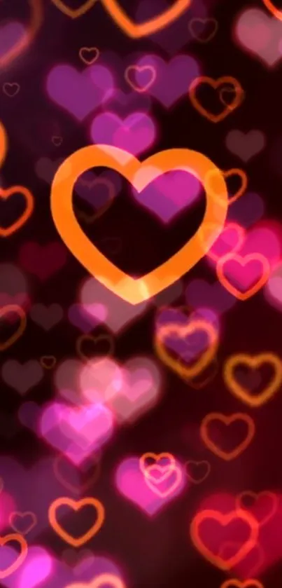 Dark orange heart on vibrant blurred pink background.