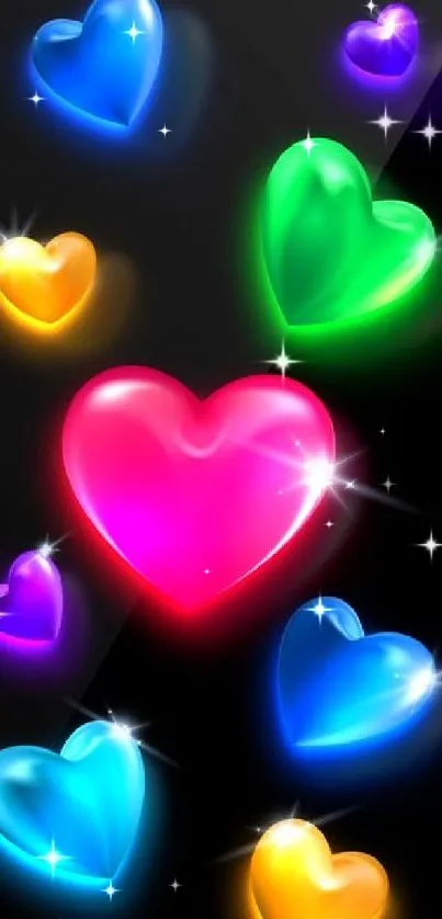 Colorful glowing heart wallpaper on black background.