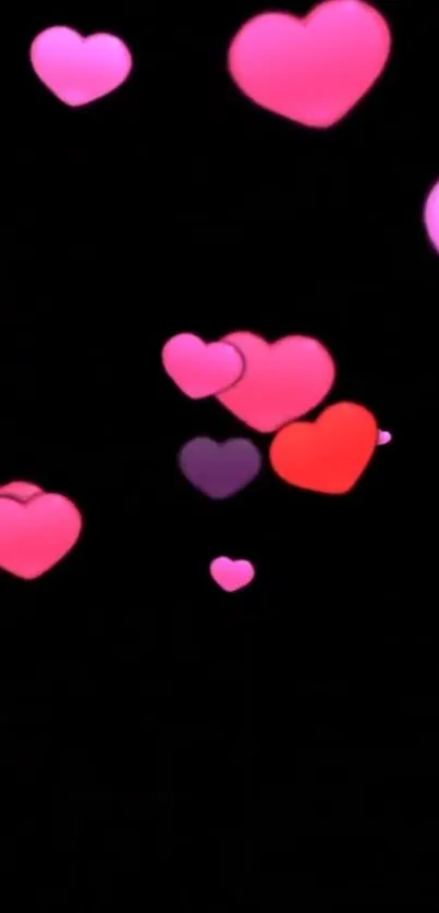 Vibrant pink hearts on a dark background.