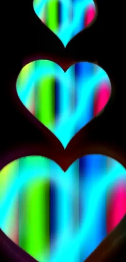 Vibrant neon heart wallpaper with bright colors on a dark background.