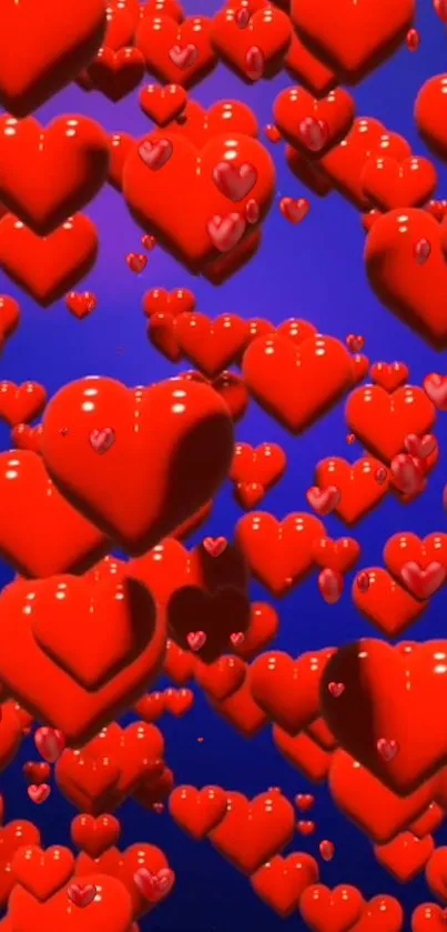 Glossy red hearts float on blue background creating a vibrant, romantic wallpaper.