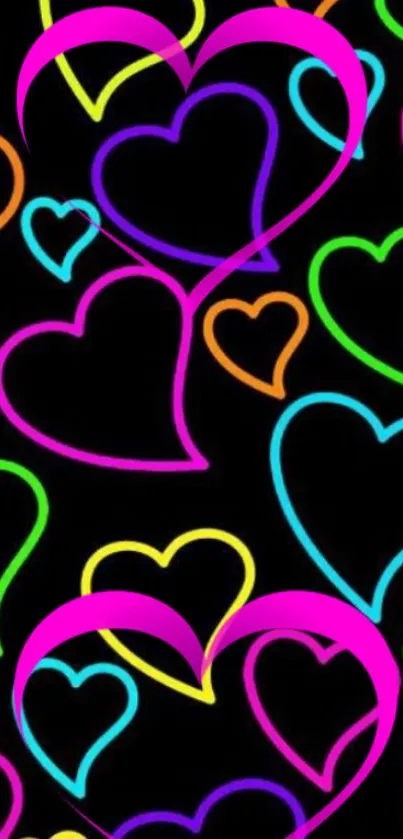 Neon hearts in fluorescent colors on a black background.