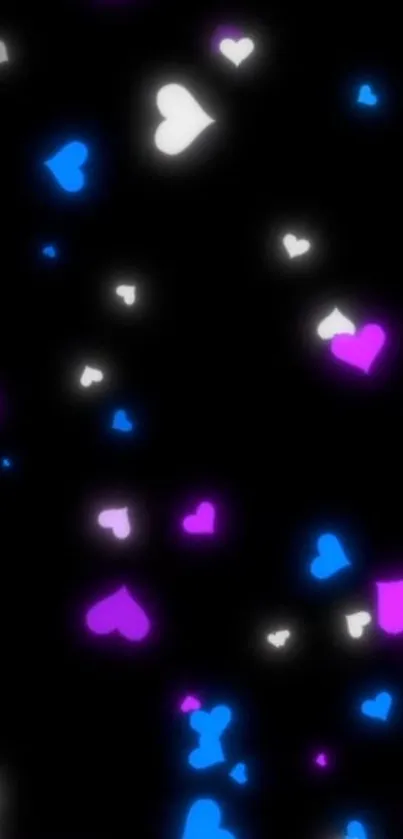 Neon glowing hearts on black wallpaper background.