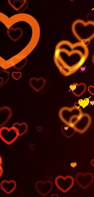 Vibrant neon heart wallpaper with glowing orange and yellow hearts.