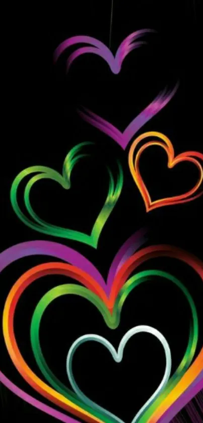 Colorful neon hearts on black background wallpaper.