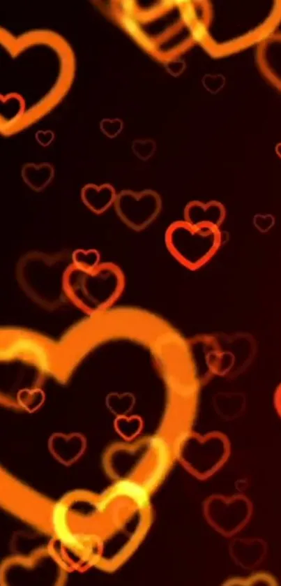 Mobile wallpaper with glowing orange and red heart patterns on a dark background.