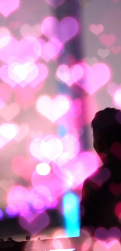 Colorful bokeh hearts with silhouette in background.