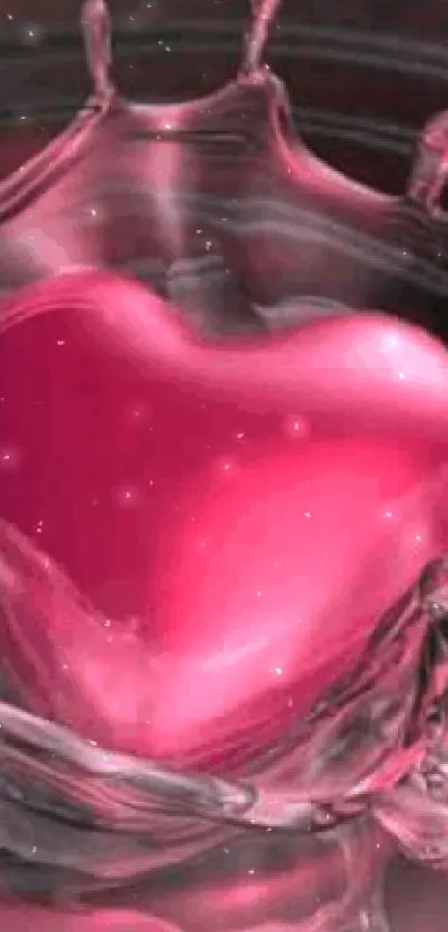 Heart shaped splash in vibrant pink liquid on phone wallpaper.