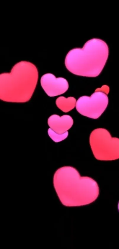 Floating pink and red hearts on a black background mobile wallpaper.