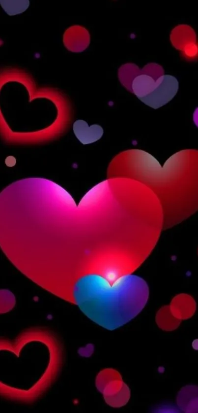 Colorful hearts on a black background wallpaper.