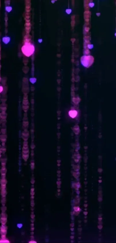 Pink and purple heart lights cascading on a dark background.