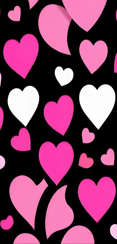 Pink and white hearts on a black background wallpaper.