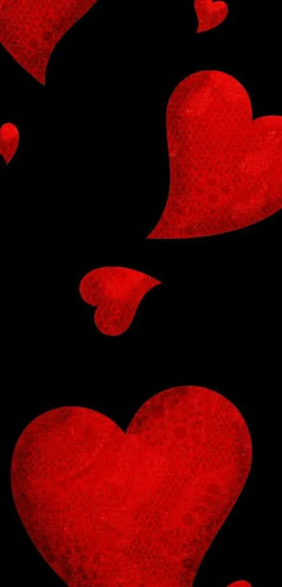 Red heart-patterned wallpaper with black background.