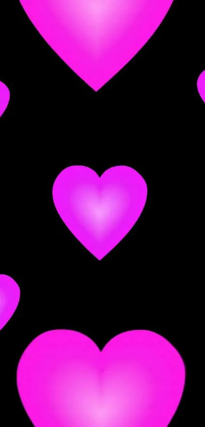 Mobile wallpaper with glowing pink hearts on black.