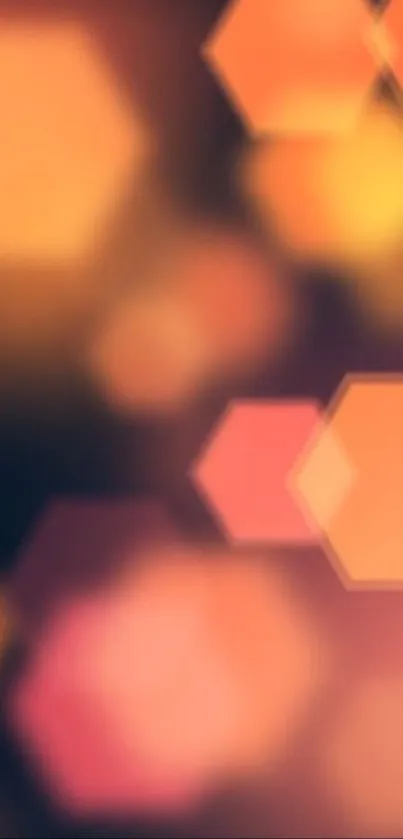 Vibrant hexagon bokeh wallpaper with warm orange and pink hues for mobile devices.