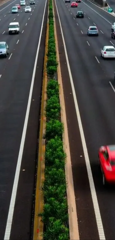 Vibrant highway with speeding cars and green dividers.