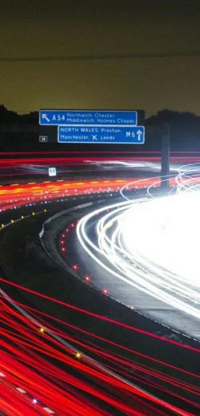 Highway light trails at night with vibrant red and white streaks.