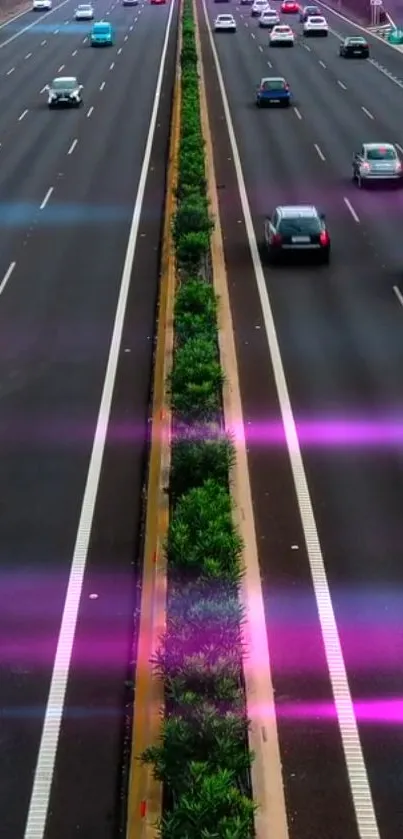 Highway with cars and pink light streaks at night.