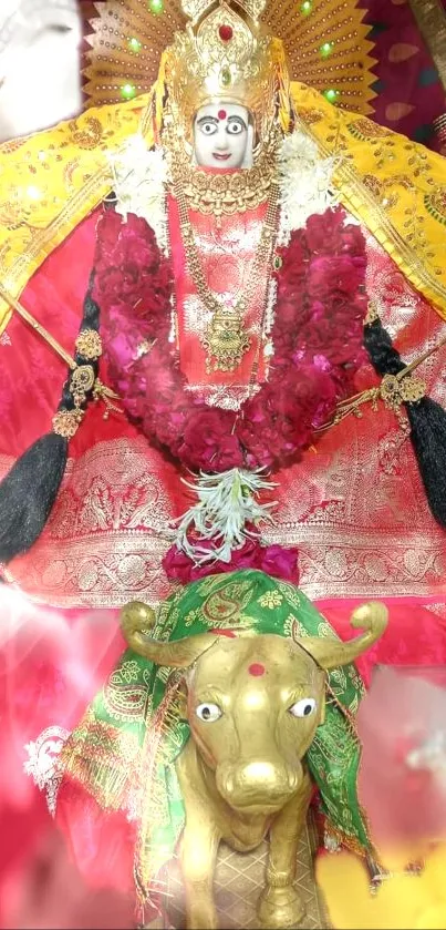 Hindu goddess in traditional attire on a vibrant red backdrop.