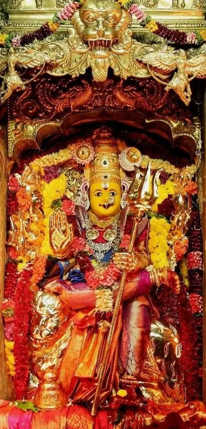 Intricate golden Hindu goddess artwork in vibrant colors.