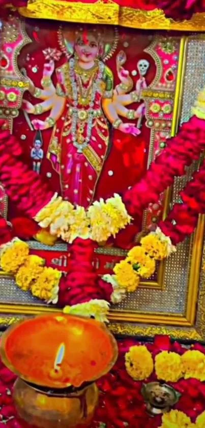 Colorful shrine art with red flowers and deity image.