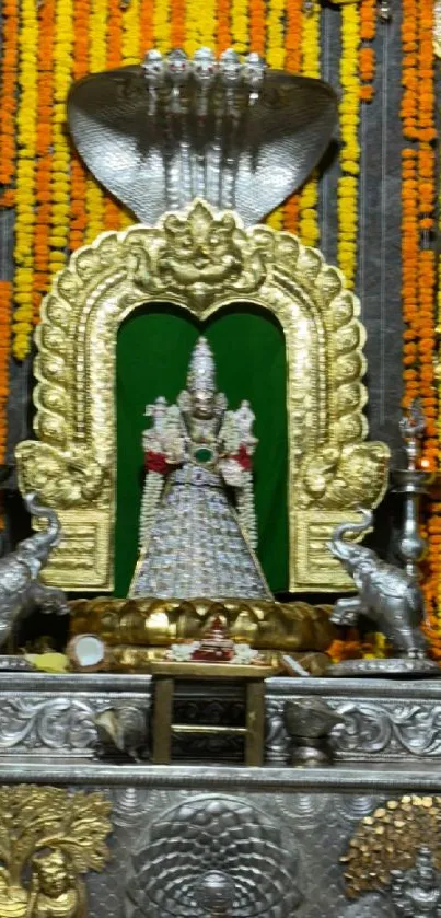 Ornate Hindu deity with vibrant backdrop.