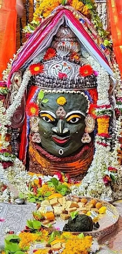 Vibrant Hindu temple decor with colorful garlands and sacred symbols.