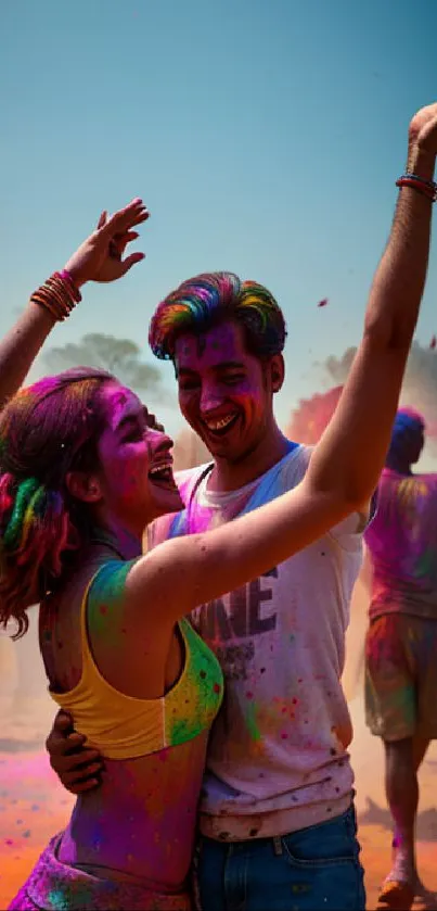 Joyful couple dancing during colorful Holi festival celebration under a blue sky.