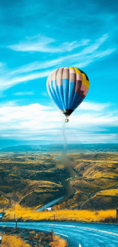 Hot air balloon over fields and sky.