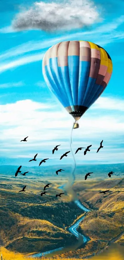 Colorful hot air balloon in a blue sky with birds flying, perfect for mobile wallpaper.