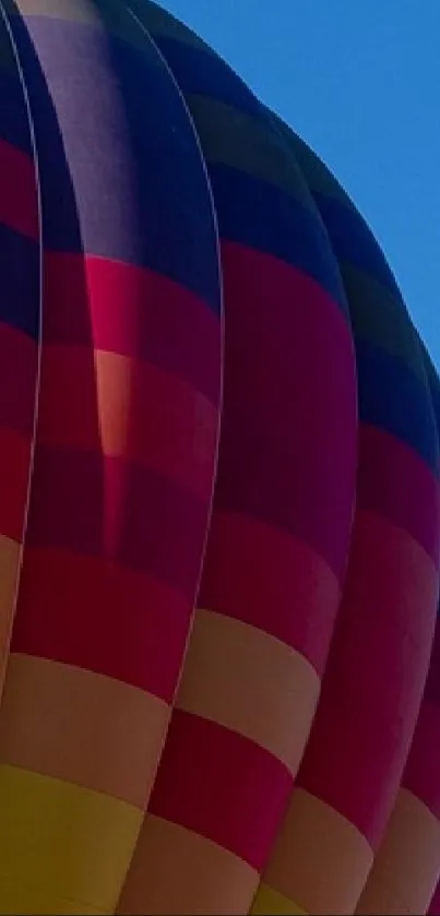 Colorful hot air balloon against a blue sky.