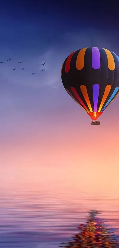 Vibrant hot air balloon over sunset sea reflection.