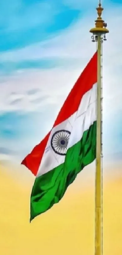 Indian flag on a tall pole against a bright sky.