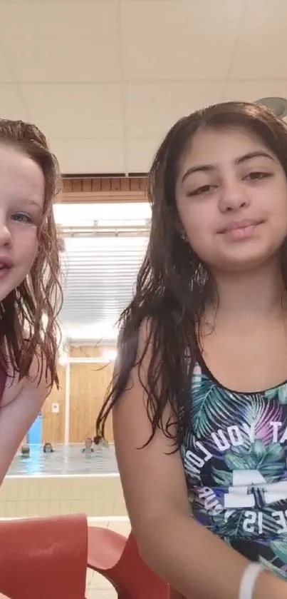 Two friends enjoying time at the indoor pool.