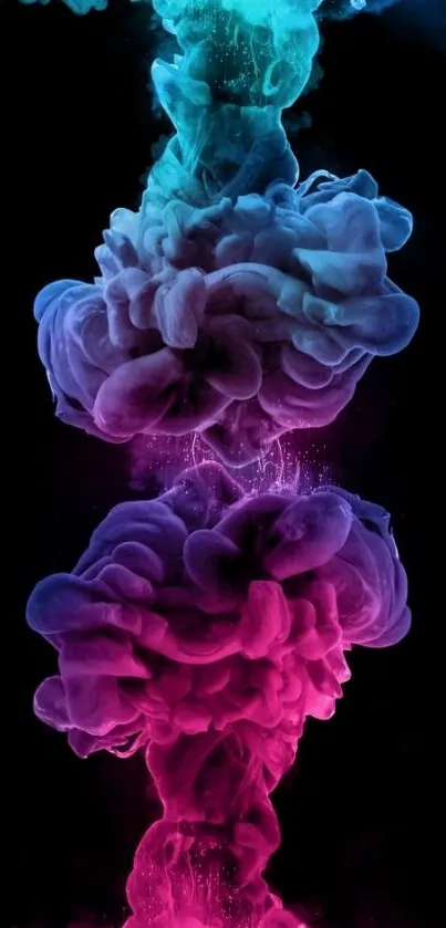 Vibrant pink and blue ink clouds on a black background mobile wallpaper.