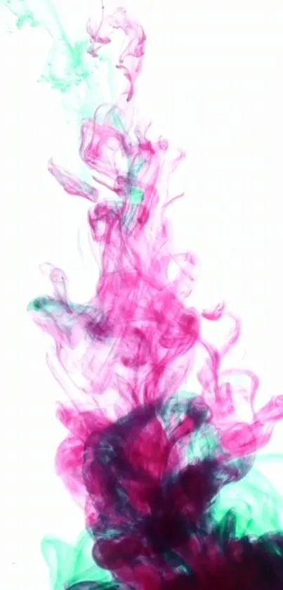 Vibrant magenta and teal ink swirling on a white background.