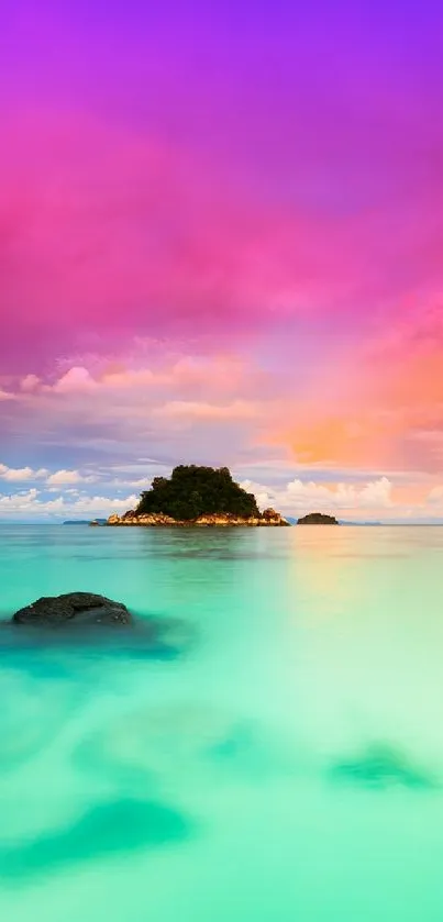 Vibrant sunset over turquoise water with an island silhouette.