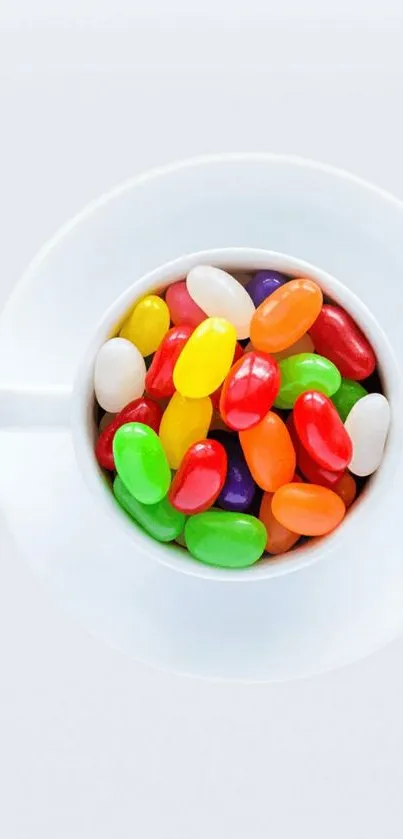 Colorful jelly beans in a white cup on a white background.