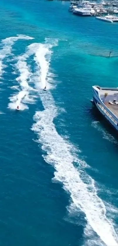 Jet skis create dynamic trails on vibrant turquoise waters.