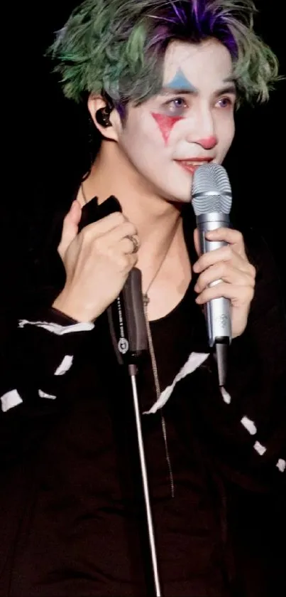 Performer with Joker makeup holding a microphone.