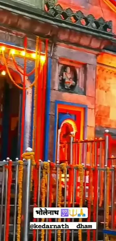 Vibrantly lit Kedarnath Temple in evening glow.