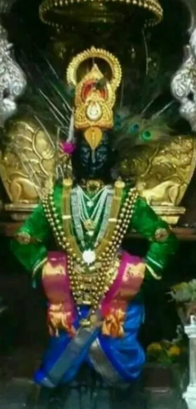 Vibrant Krishna temple artwork with green attire and ornate jewelry.