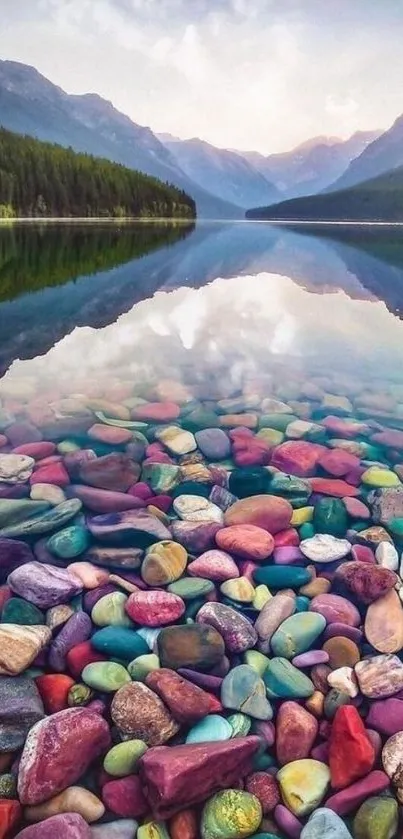 Scenic lake with colorful stones reflecting serene mountain backdrop.